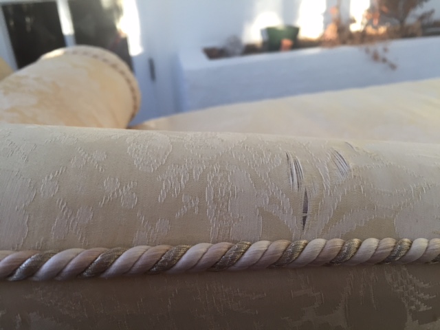 Silk sofa upholstery deteriorating and ripping from prolonged sun exposure